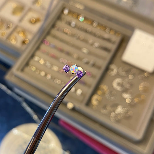 Piercing tris viola unicorno
