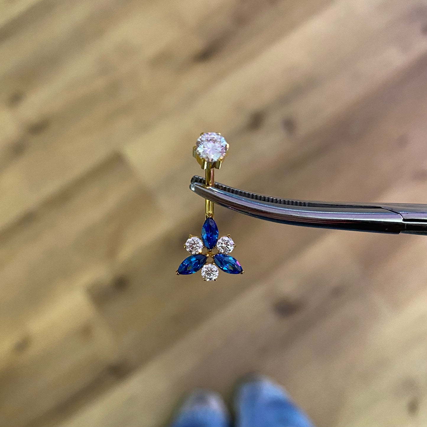 Piercing ombelico fenice blu